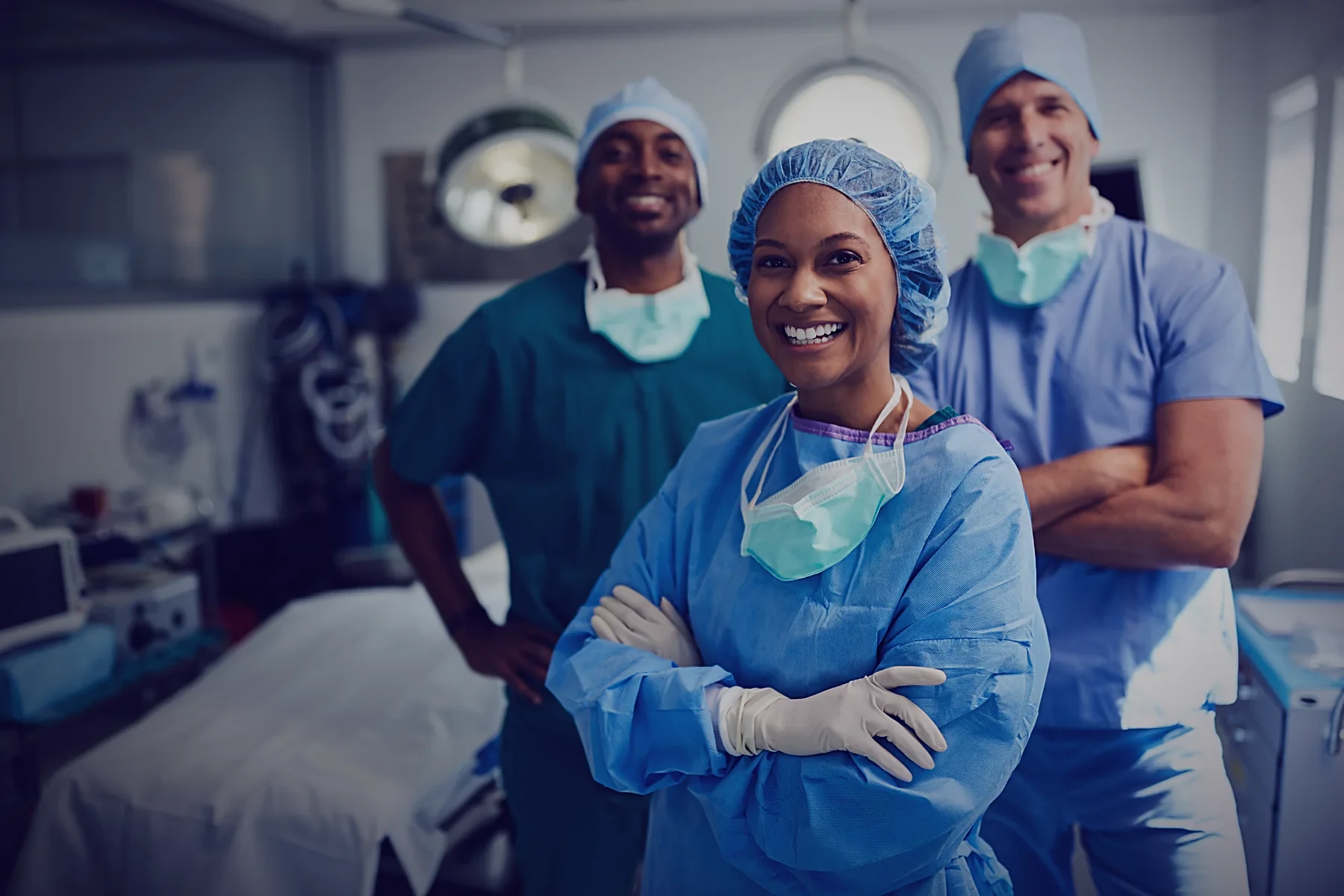 Theatre team members standing together in an operating room